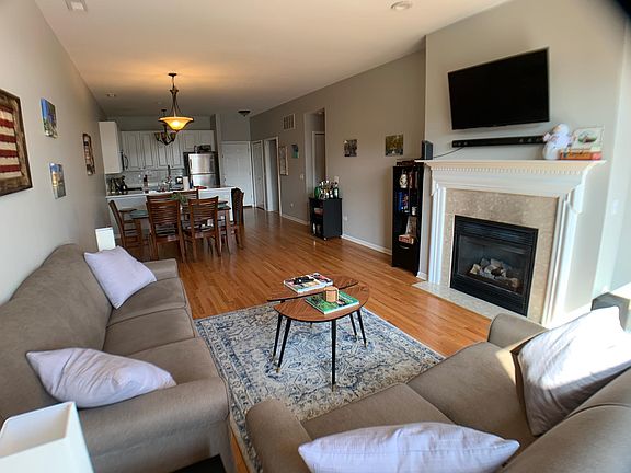 Hardwood floors, gas fireplace open concept floor plan.