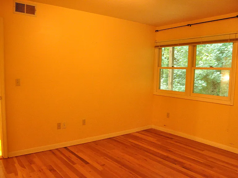 Bedroom and Great room have large windows with private views of dense forest.