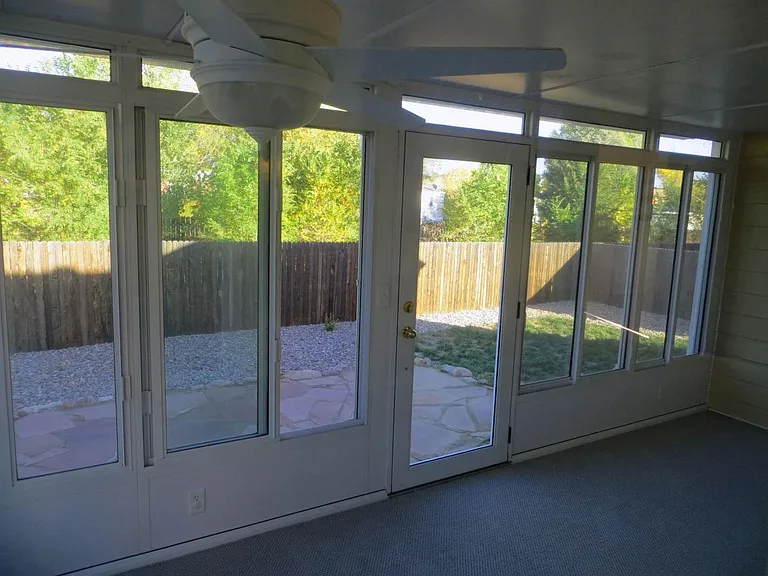 Sunroom and back stone patio