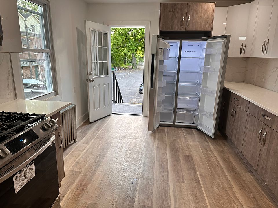 Newly renovated kitchen LARGE Samsung side-by-side fridge.
