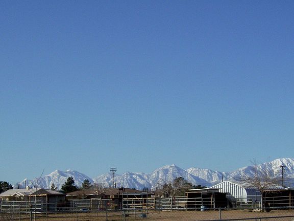 View of snow cap mountains in back yard