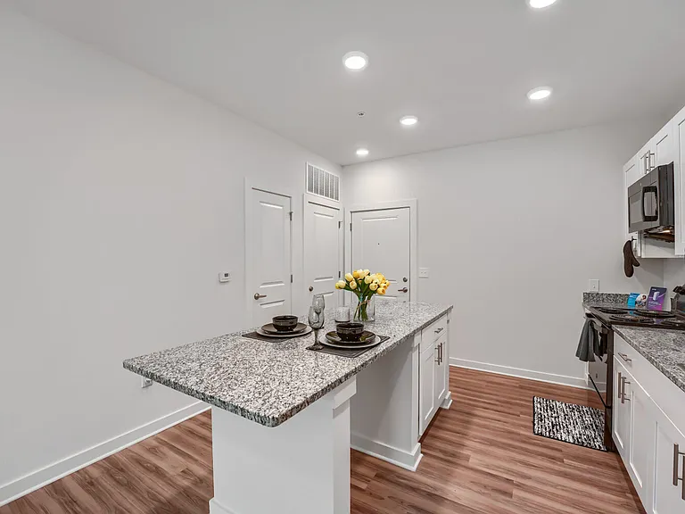 Kitchen with view of front door entrance