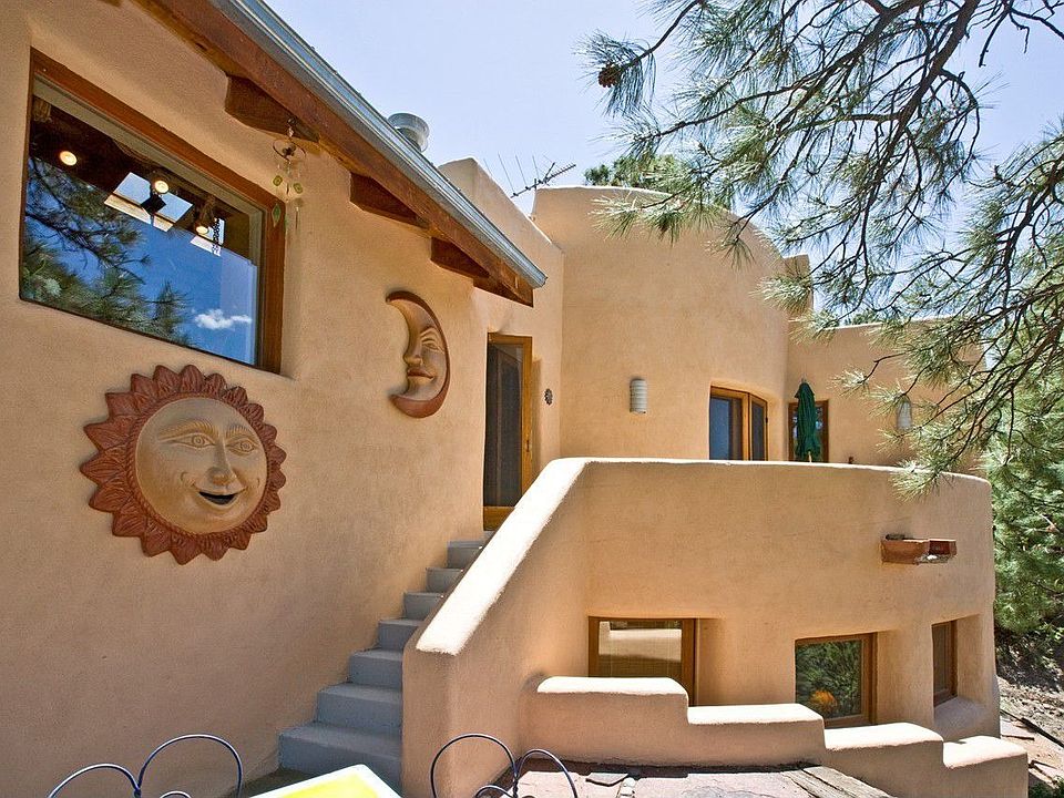 Tucked away high in the hills above Santa Fe off a private road...