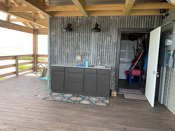 Deck, outdoor sink, storage.