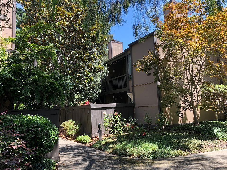 Building exterior on garden path to unit.