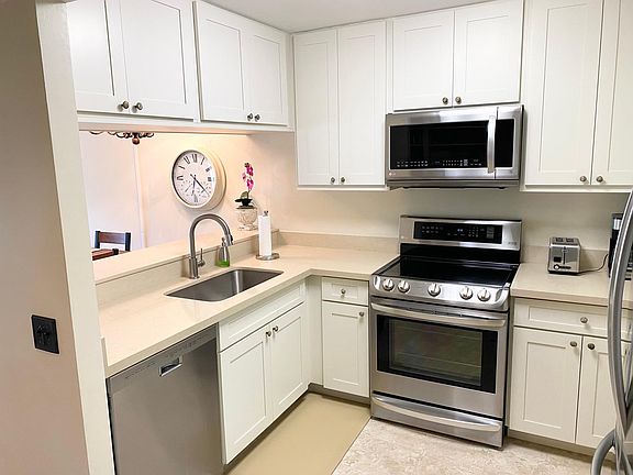 Kitchen with all stainless steel appliances and recently renovated!