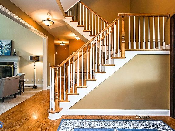 This grand 3 story staircase welcomes you and your guests to this spacious home.