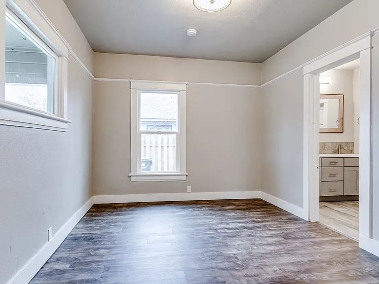 Bedroom 2 is light and bright with access to the bathroom and a step in closet.
