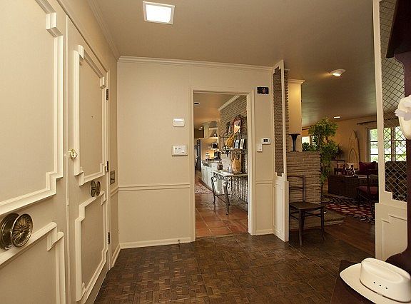 Entry foyer opens to living areas