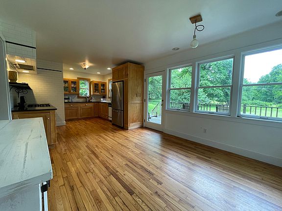 Kitchen and dining area with view of the door to the porch