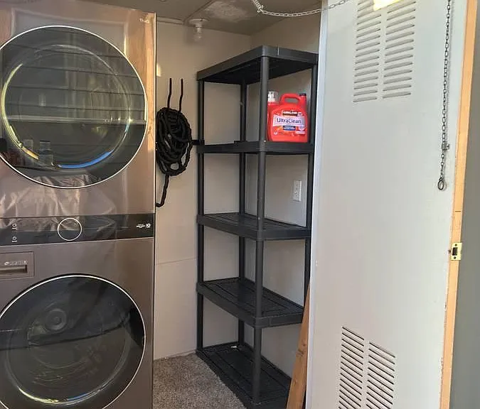 In unit washer and dryer are quickly accessible through slider door and have substantial storage space.