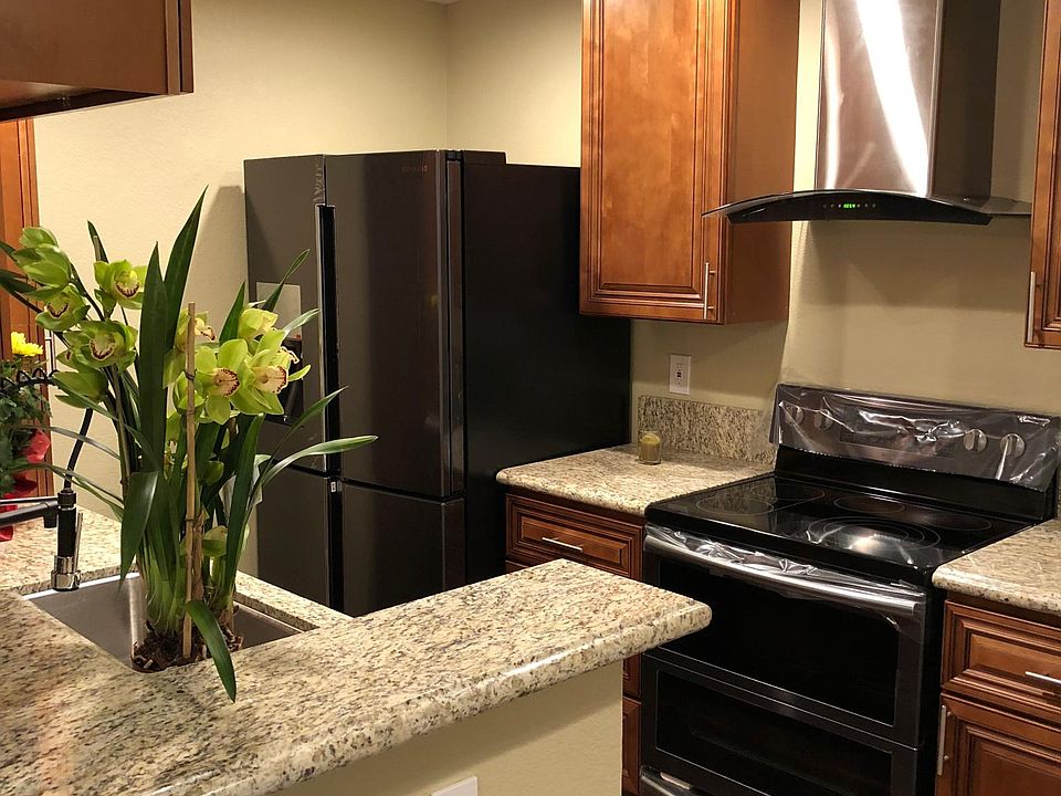 Gourmet kitchen w/ high end black stainless steel appliances
