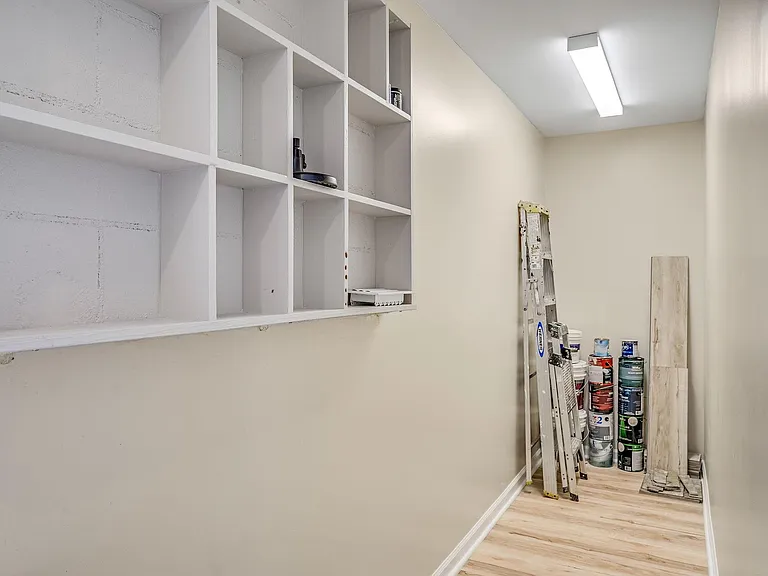 Large climate-controlled storage room behind laundry room.