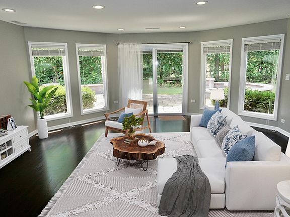Living room with slider doors leading to the backyard and patio.