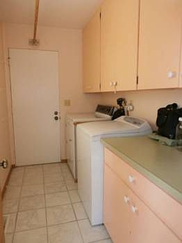 A main floor laundry that includes the washer and dryer.