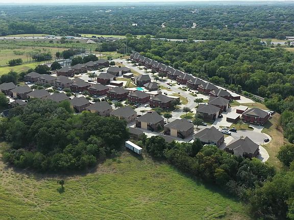 Woodhaven Villas Aerial View- A Quiet Neighborhood Surrounded By Trees