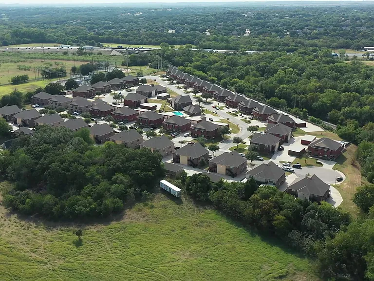 Woodhaven Villas Aerial View- A Quiet Neighborhood Surrounded By Trees