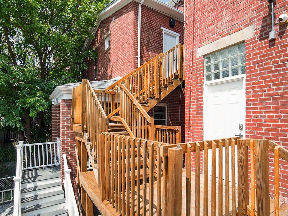 This rear entrance off of the off street parking area goes to the common area hallway.