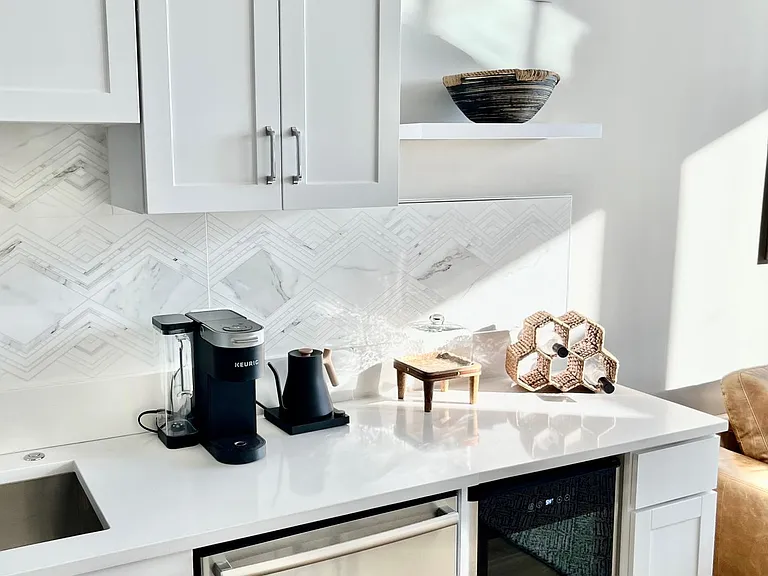 Wine fridge and coffee bar area with Keurig coffee maker and electric teapot