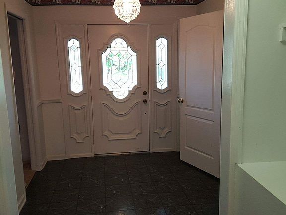 Foyer with shelve for storage & hanging coats.