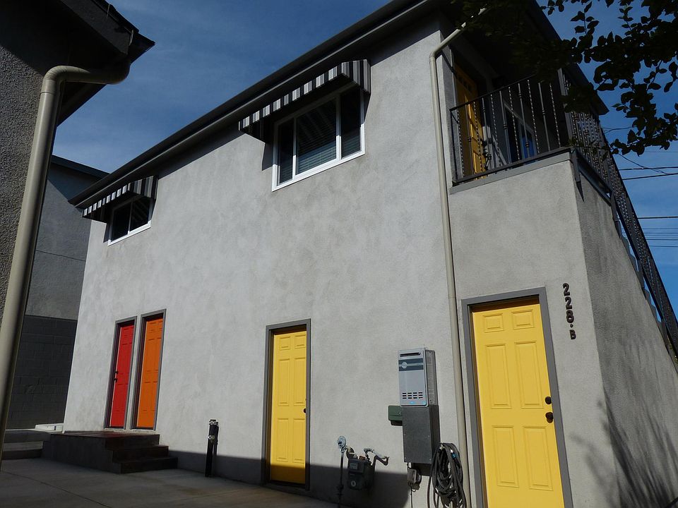 Looking up at the unit from ground level. The 2 yellow doors are the private/locked storage rooms.