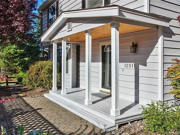 Off the gorgeous paved area out front, enchanting stepping stones take you around the side of the house.