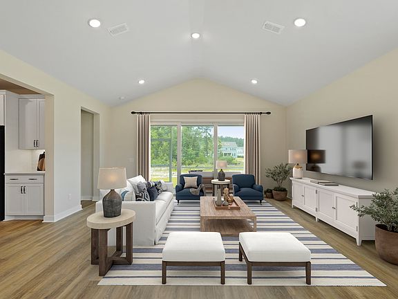 Great room featuring vaulted ceiling