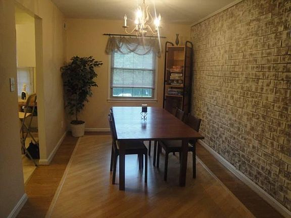 Dining Room with chic brick wall.