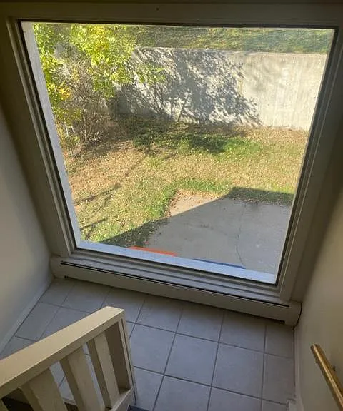 One of two landing areas coming down the stairs. Nice big windows make it bright