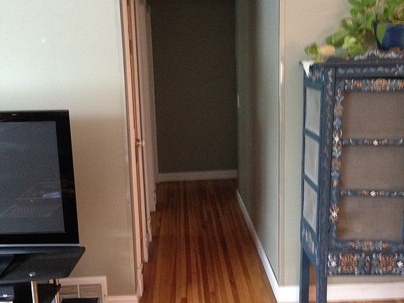 Hallway on main floor to 3 beds 1 full bath.