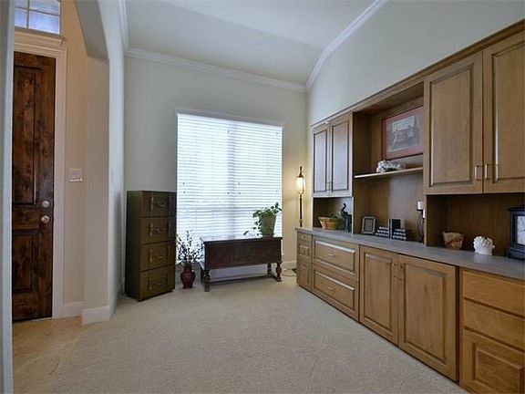 Foyer open to Office or Formal Living Room that features crown molding.