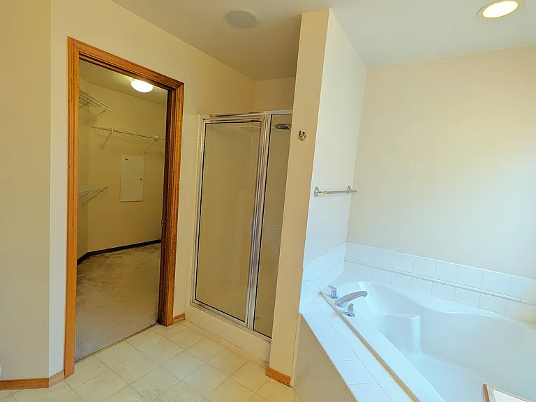 Master Bathroom - tub, shower and walk-in closet
