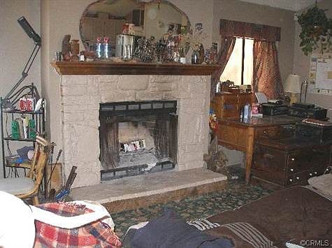 NICE  COZY FIREPLACE GREETS YOU AS YOU ENTER FROM THE FRONT PORC