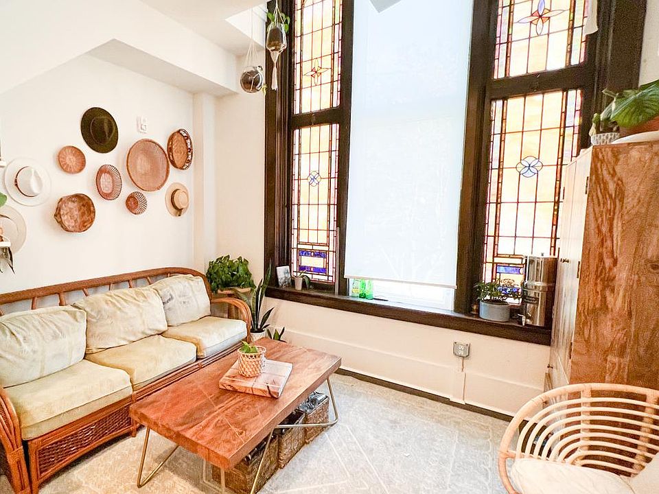 Stained glass and cozy corners accentuate the beauty of this unique loft in the heart of the arts district.