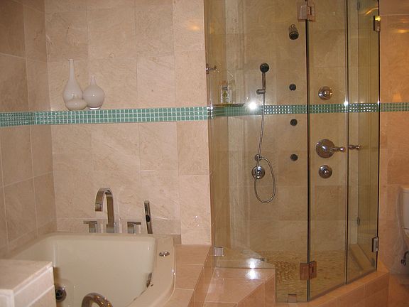 Master bath with jacuzzi tub and spa shower
