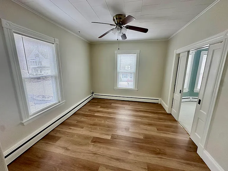 Living room with access to primary bedroom