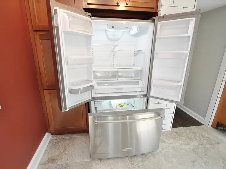 large Stainless steel French door Kitchenaid refrigerator with filtered Ice and Water dispenser