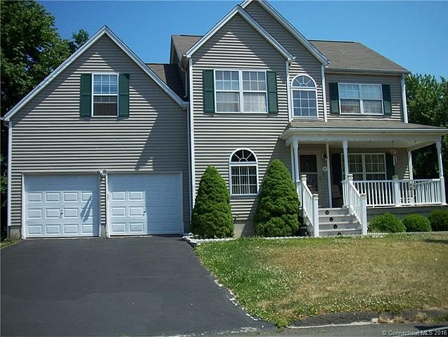 FRONT OF HOUSE WITH GRANITE...