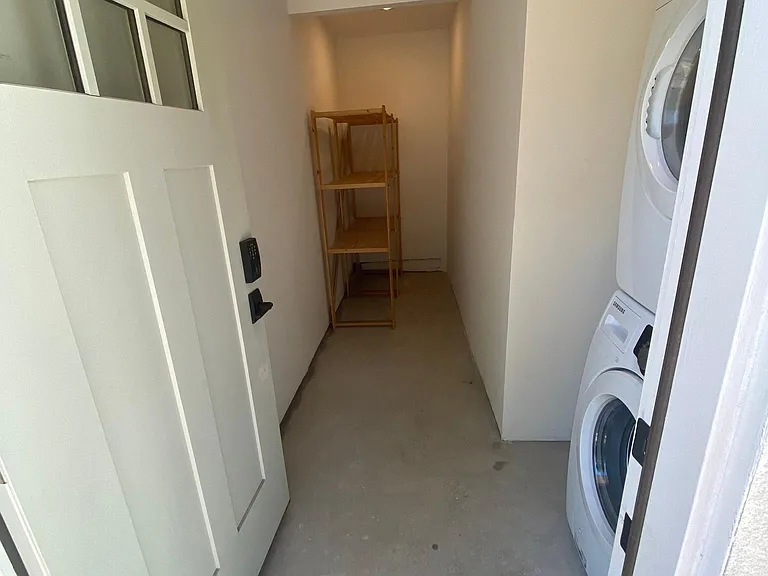 Separate storage unit with washer and dryer.