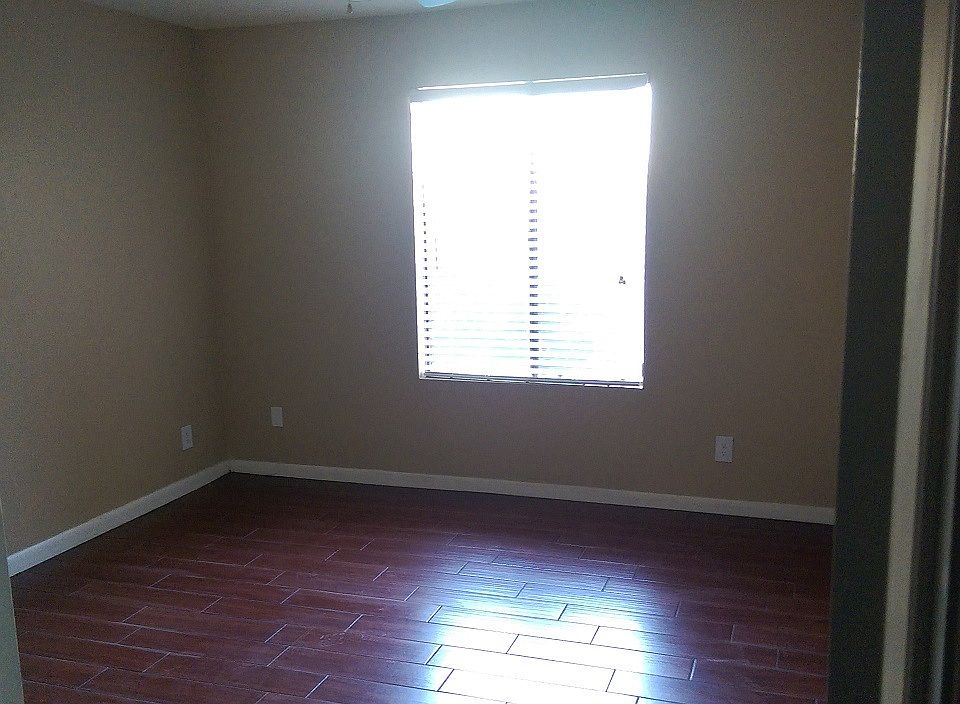 Bedroom with new tile "wood look" flooring