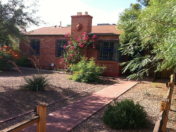 Front with split rail fence.
