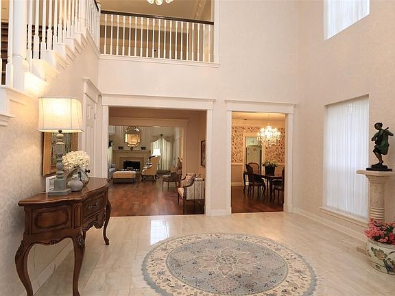 WIDE OPEN FOYER SHOWS ELEGANT ARCHITECTURE AND CUSTOM MOLDINGS