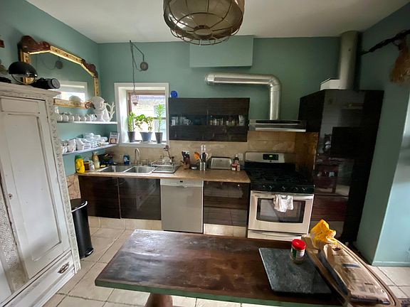 Spacious updated kitchen with stainless steel appliances.