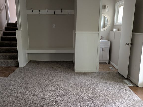 New bench and hooks near garage entry