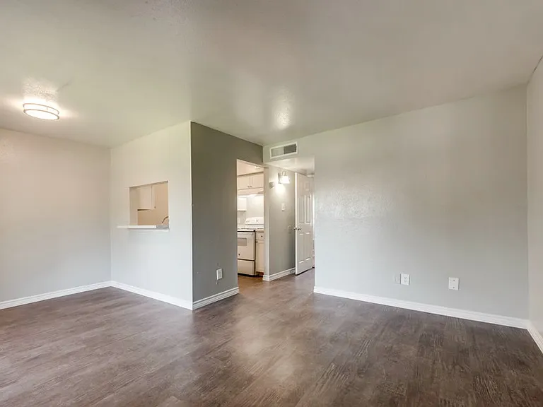 Open living area with modern flooring and functional layout