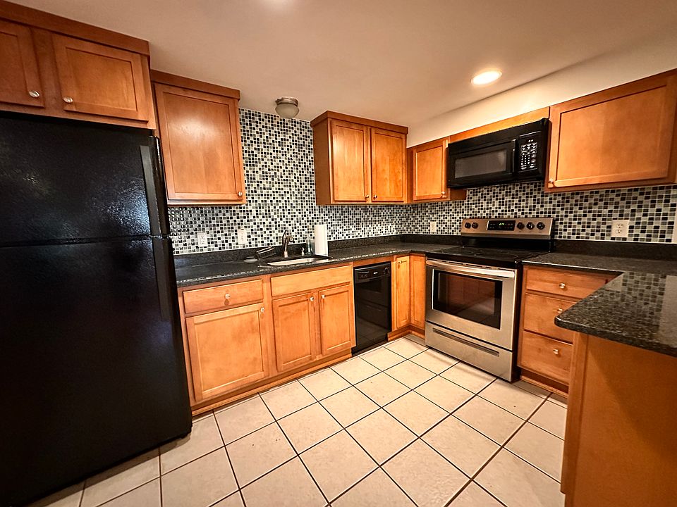 Kitchen features refridgerator, electric stove, dishwasher, disposal, microwave and plenty of cabinet space.