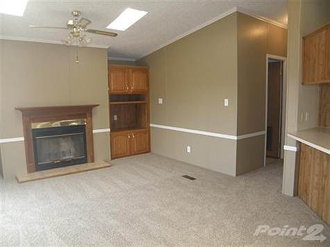 Comfortable Gathering/Family Room * Brand New California Frize Carpet * Freshly Painted Throughout * Cozy Woodburning Firepalce * Cathedral Ceilings * Skylights to bring the Outdoors In * Door to the Deck overlooking Peaceful Woods and Quaint Pond!