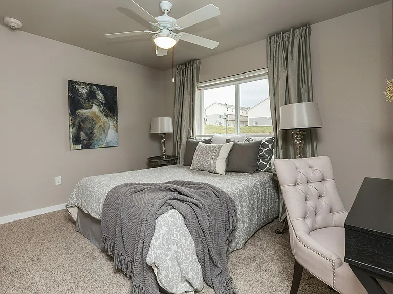Relax in a beautifully bedroom at Legacy Landing, complete with plenty of extra space to make it your own.