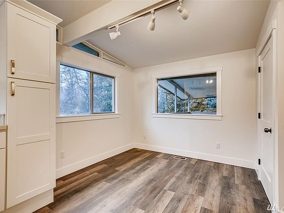 What a fabulous eating nook.  Powder room is the door on the right.