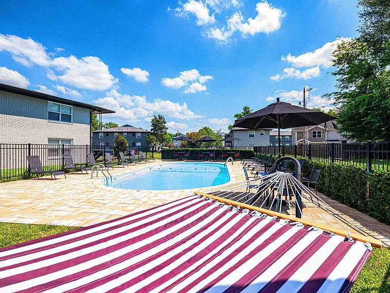 Swimming pool and sundeck with hammock
